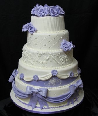 Every tier of this cake is different with beautiful drapery lovely sugar 